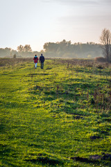 Man and woman walking in the distance