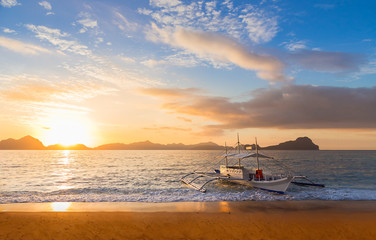 Banca boat at sunset in Palawan Island, Philippines