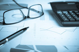 Fototapeta  - Business and finance concept.Calculator,chart,document,pen and graph on the table.