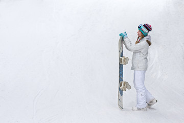 Wall Mural - winter, sport concept, happy young woman with snowboard outdoors