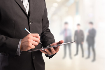 Poster - Business man working with a digital tablet