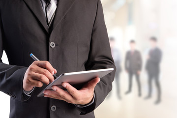 Poster - Business man working with a digital tablet