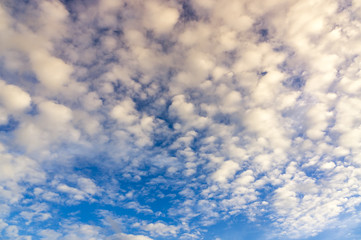 Dramatic fluffy clouds during sunset