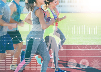 Wall Mural - Heart rate monitor concept. Young people running at stadium