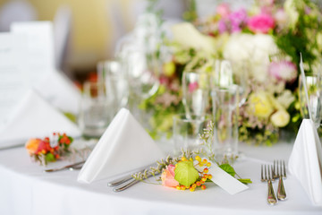 Beautiful table setting with crockery and flowers for a party, wedding reception or other festive event