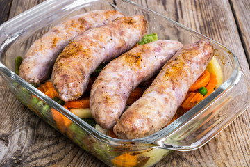 Wall Mural - Country sausage with vegetables baked in the shape of glass