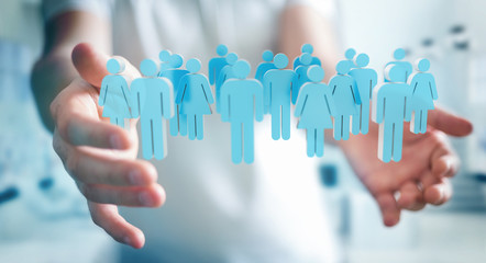 Aufkleber - Businessman holding 3D rendering group of people in his hand