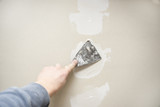 Fototapeta  - Drywall repair plastering closeup