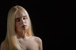 © tugolukof - sensual blond girl with closed eyes portrait on black background