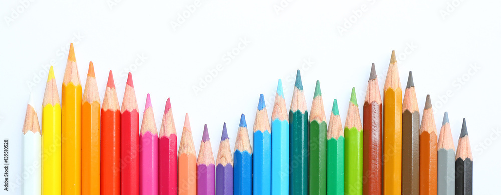 colored pencils row with wave on white background - obrazy, fototapety, plakaty 