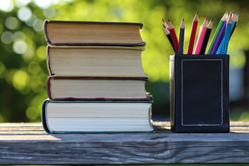 Canvas Print - book stack background table wooden outdoor