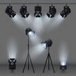 © MicroOne - Lighted stage with studio spotlights vector illustration