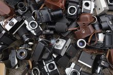 Multiple Old Cameras And Lenses At Flea Market