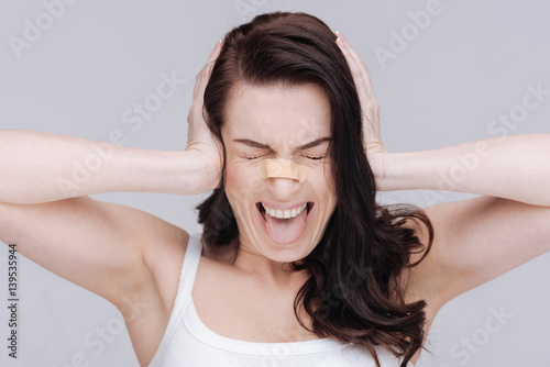 Fotografia, Obraz Emotional young lady overwhelmed with criticism
