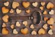 key to heart on wooden background