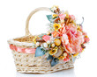 basket decorated with flowers isolated on white
