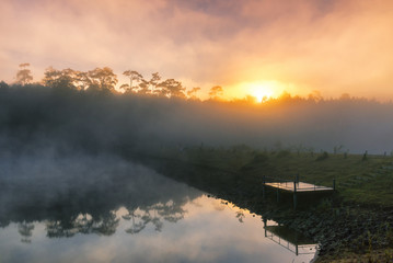 Wall Mural - sunrise and mist in beautiful lake with morning fog