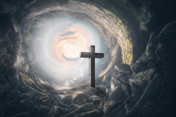 Cross in a cave. Easter. Religious concept.