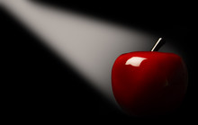 Red Apple In A Spotlight On A Black Background