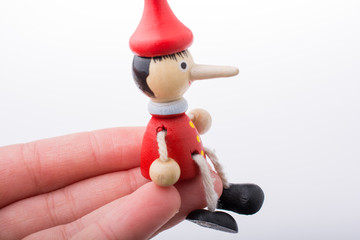 Wooden pinocchio doll with his long nose