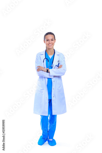 Fotografering Woman doctor with stethoscope standing with arms crossed isolated on a white bac