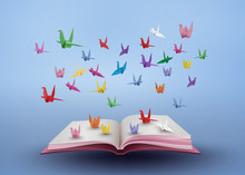 Origami Made Colorful Paper Bird Flying Over Open Book