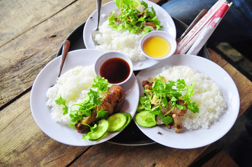 Wall Mural - Vietnamese broken rice or com tam with fried chicken legs, pork and herbs