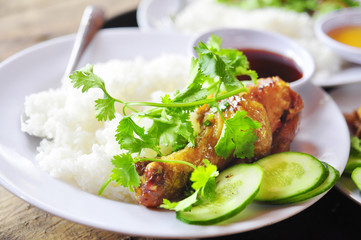 Wall Mural - Vietnamese broken rice or com tam with fried chicken legs, pork and herbs