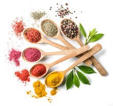 Assortment Of Colorful Spices In The Wooden Spoons On The White Background.