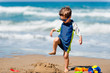 © Microgen - Cute boy demolishing sand castle