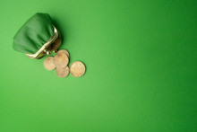 Green Purse Coin EURO On Green Background. Top View