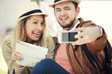 Wall Mural - Tourist Couple at the Bus Station