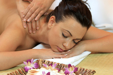 Young woman relaxing with a massage