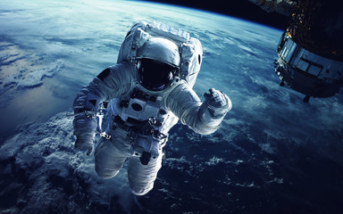 Wall Mural - Astronaut in outer space. Elements of this image furnished by NASA