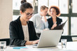 © Kzenon - Hard-working young woman analyzing business information