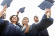 © Syda Productions - happy students or bachelors waving mortar boards