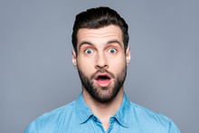A Close Up Portrait Of A Young Surprised Man With Opened Mouth Isolated On Gray Background