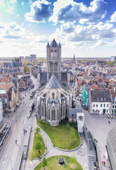 Wall Mural - GENT, BELGIUM - MARCH 2015: Tourists visit ancient medieval city. Gent attracts more than 1 million people annually