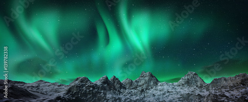 Fotografía Aurora borealis above snowy islands