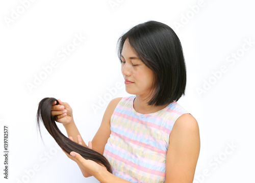Asian Woman Donating Her Hair To Cancer Patients Holding