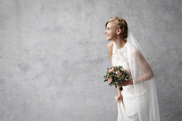 Wall Mural - Beautiful smiling bride in studio