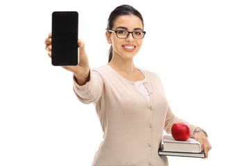 Wall Mural - Female teacher showing a phone and smiling