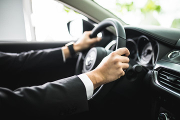 close up of young man driving car