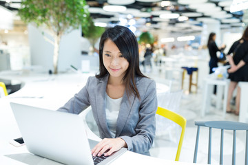 Poster - Businesswoman working on notebook computer