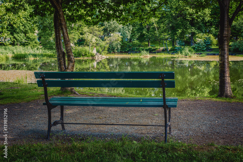 Park Bench Shaded Under The Trees In The Halifax Public Gardens