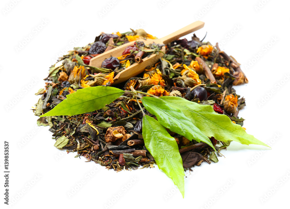 Green tea in wooden spoon with leaves isolated on white