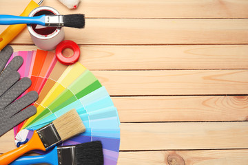 Color swatches and tools on wooden background