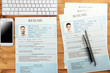 © Africa Studio - Employer workplace with resumes