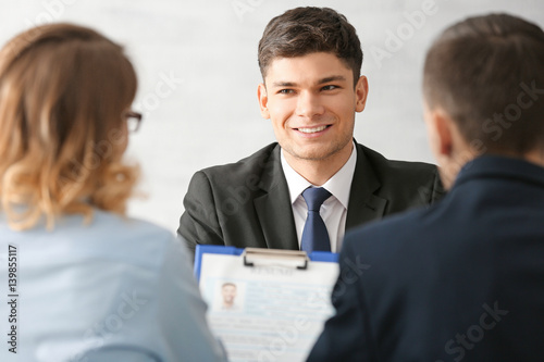 Fotografiet Human resources commission interviewing young man