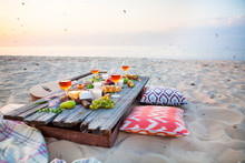 Picnic On The Beach At Sunset In Boho Style, Food And Drink Concept